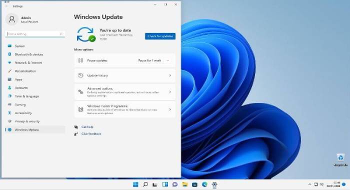 windows 11 desktop with windows update settings screen open